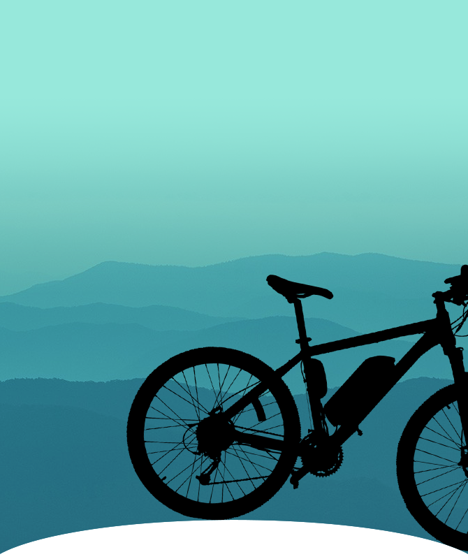 Electric bike silhouette in front of hills.