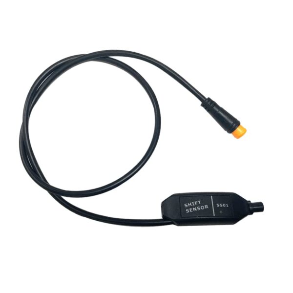 A black plastic gear sensor for an electric bike with a short wound up cable coming out of it